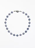 Necklace with blue beads on a white background