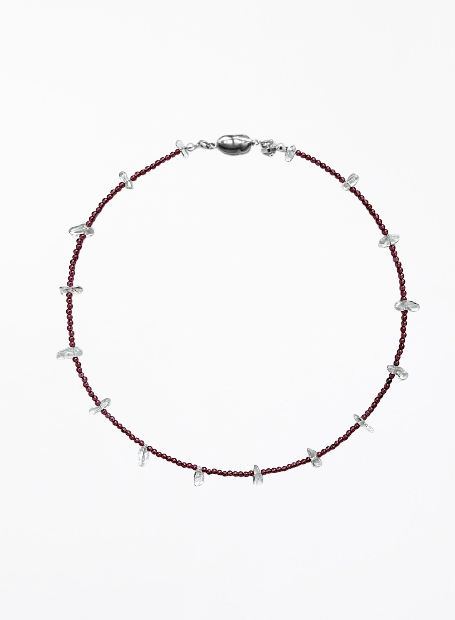 red necklace and small white beads on a white background