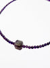 Purple amethyst necklace with square pendant on a white background