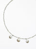 Necklace with three cultured pearl beads on a white background