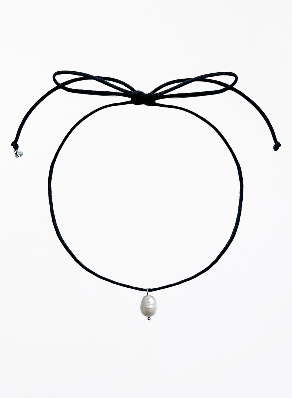 Black choker necklace with a pearl pendant on a white background