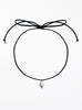 Black choker necklace with a pearl pendant on a white background