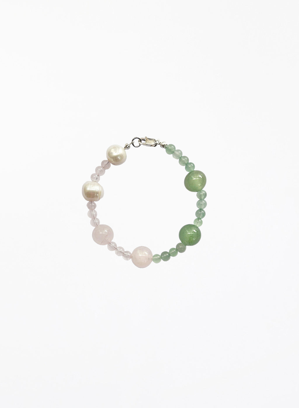 Beaded bracelet with pearls and green pink  stones on a white background