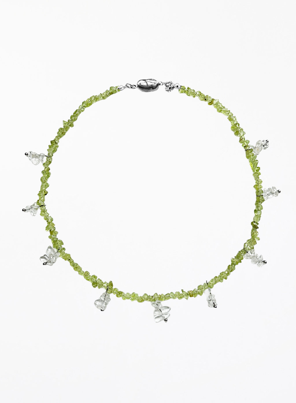 Necklace with green beads and white beaded charms on a white background