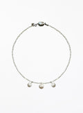 Necklace with three cultured pearl beads on a white background