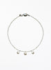 Necklace with three cultured pearl beads on a white background