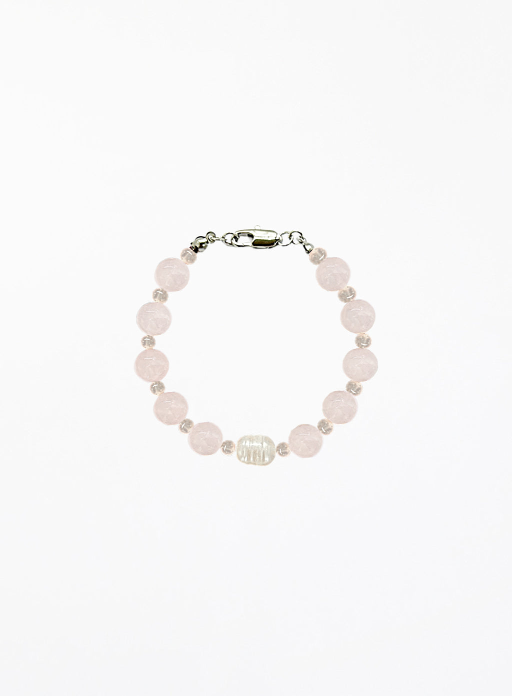 Bracelet with rose quartz beads and solo pearl on a white background