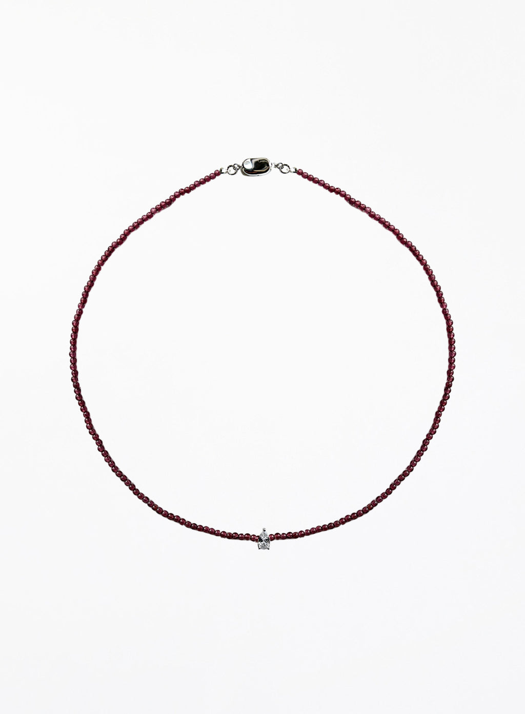 Thin garnet beaded necklace with tear drop charm on a white background