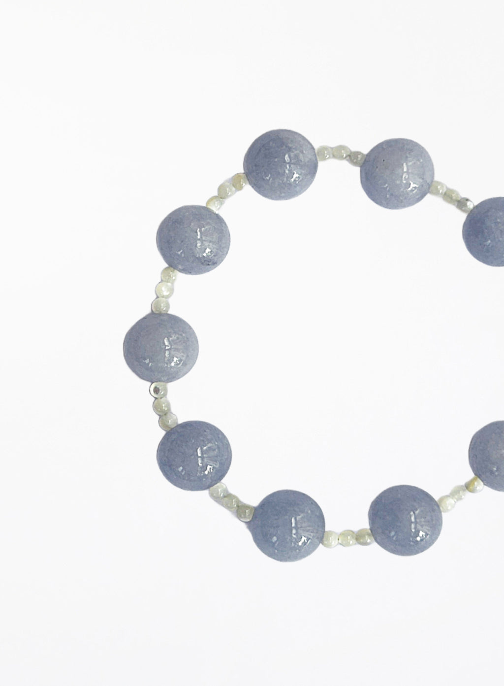 bracelet with blue beads on a white background
