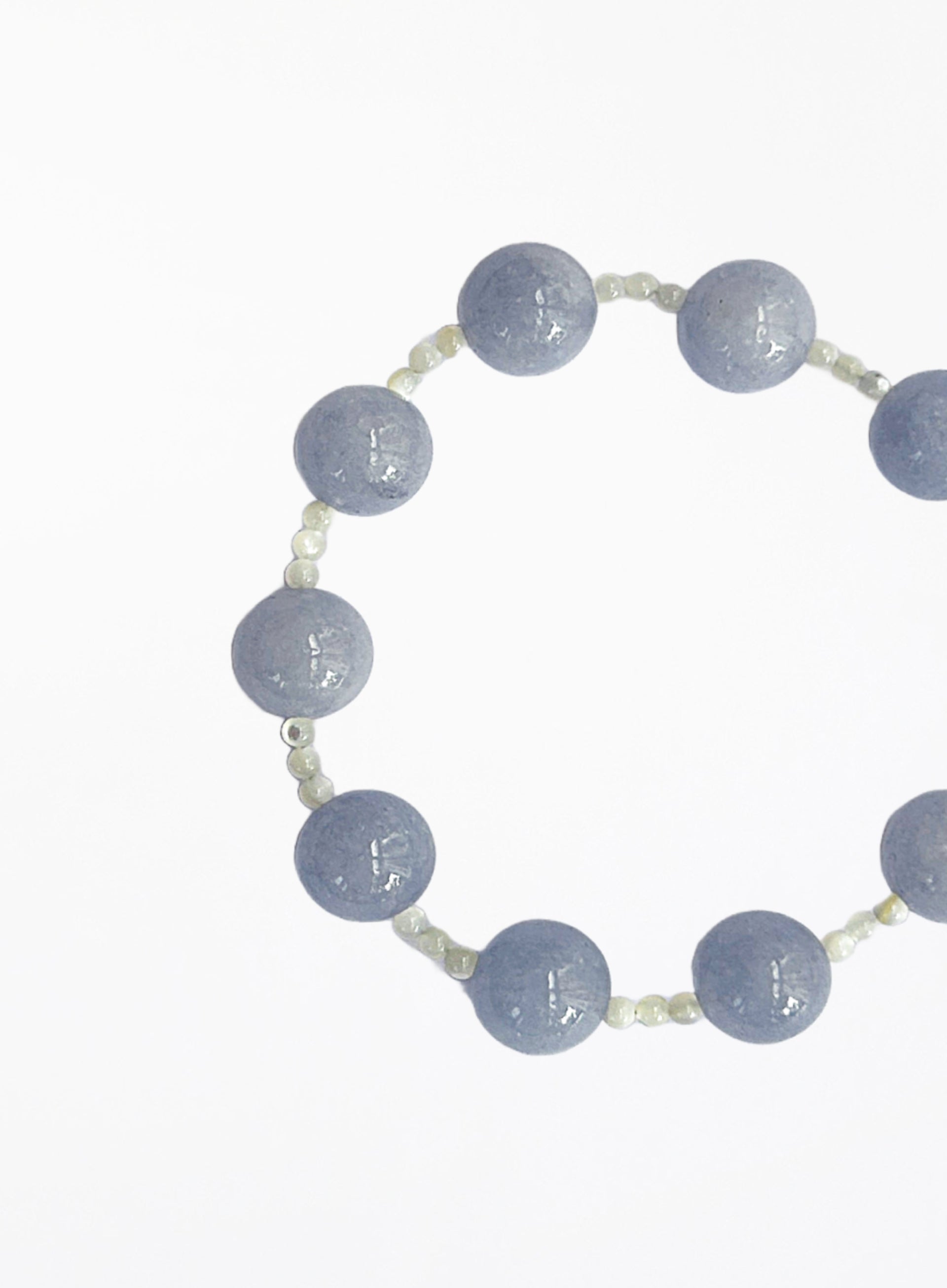 bracelet with blue beads on a white background