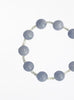 bracelet with blue beads on a white background