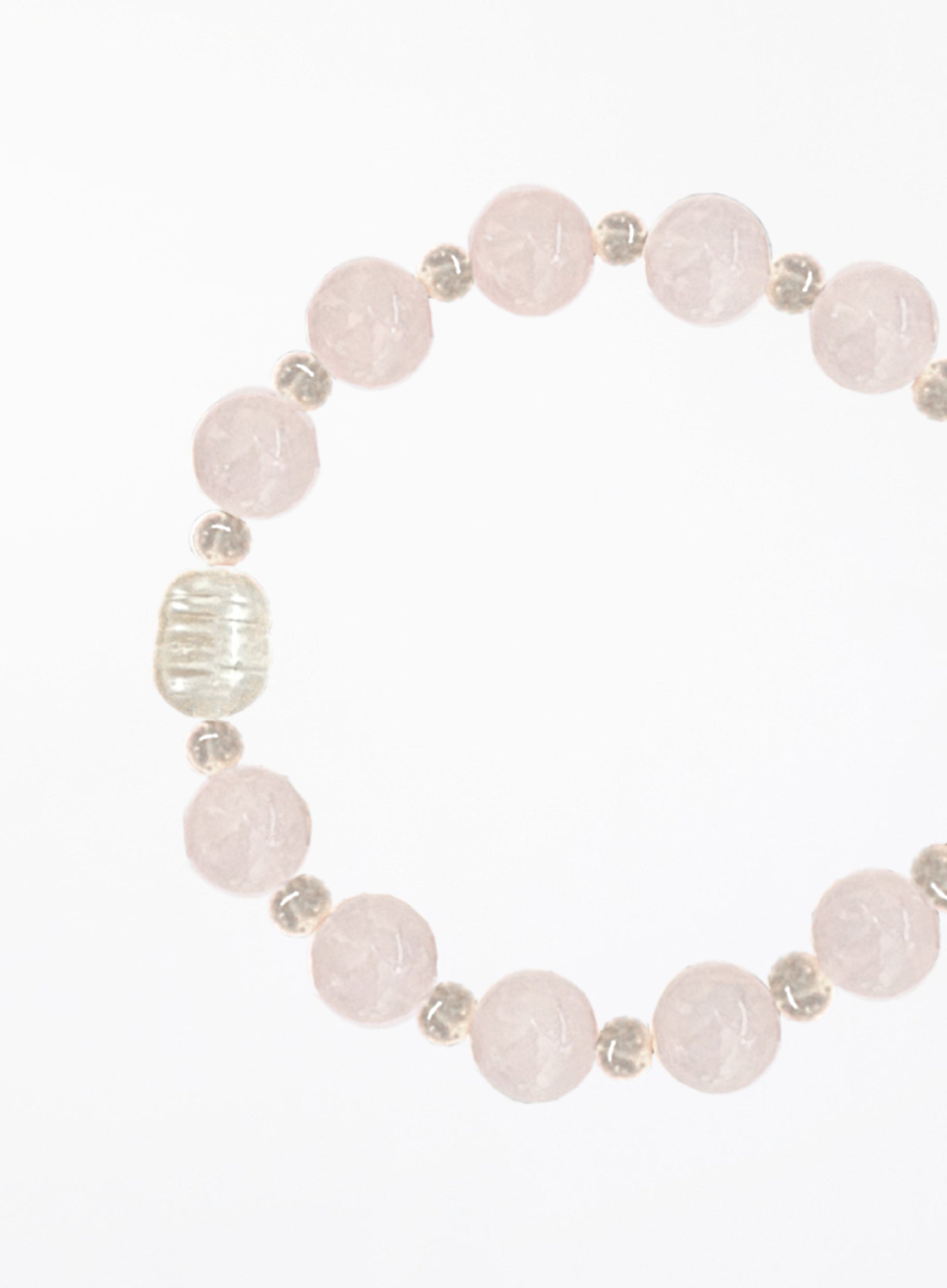 Bracelet with rose quartz beads and solo pearl on a white background
