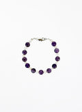 Bracelet with amethyst beads and pearls with silver clasp on a white background