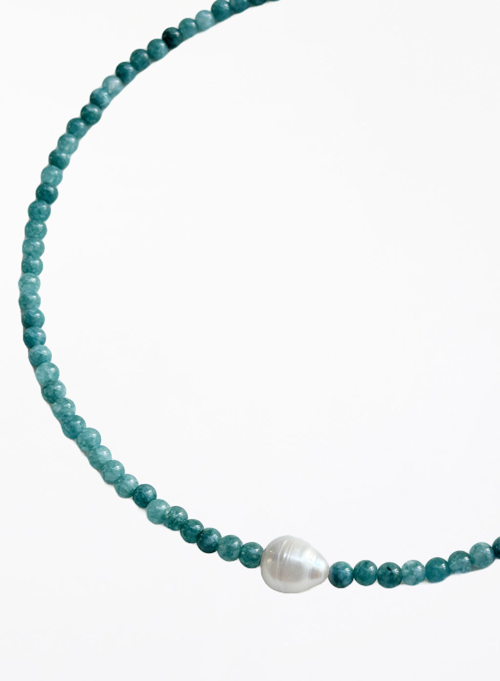 Turquoise beaded necklace with a pearl pendant on a white background