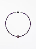 Purple amethyst necklace with square pendant on a white background