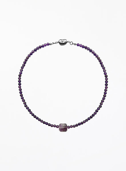 Purple amethyst necklace with square pendant on a white background