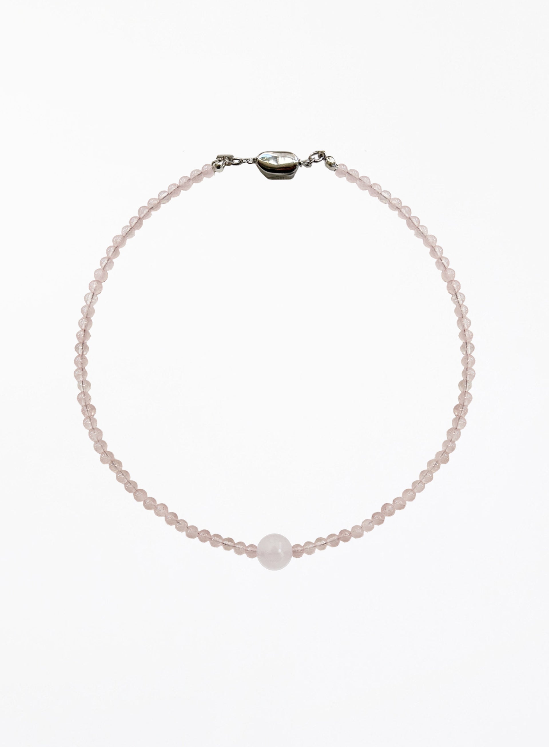 pink necklace on a white background