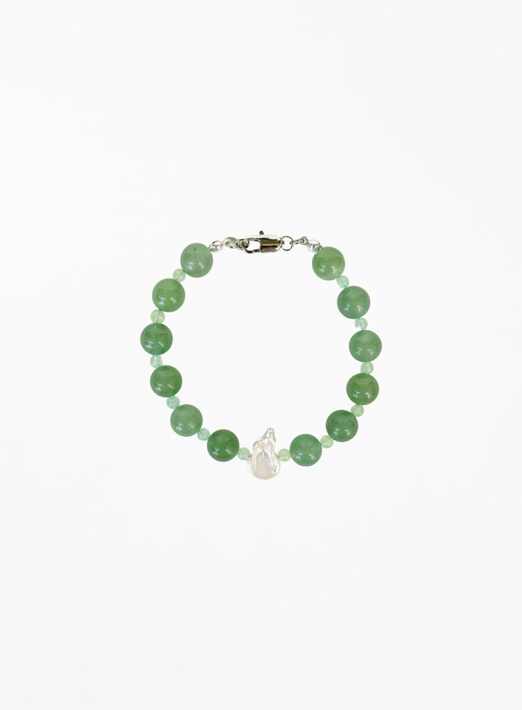 Green beaded bracelet with pearl on a white background