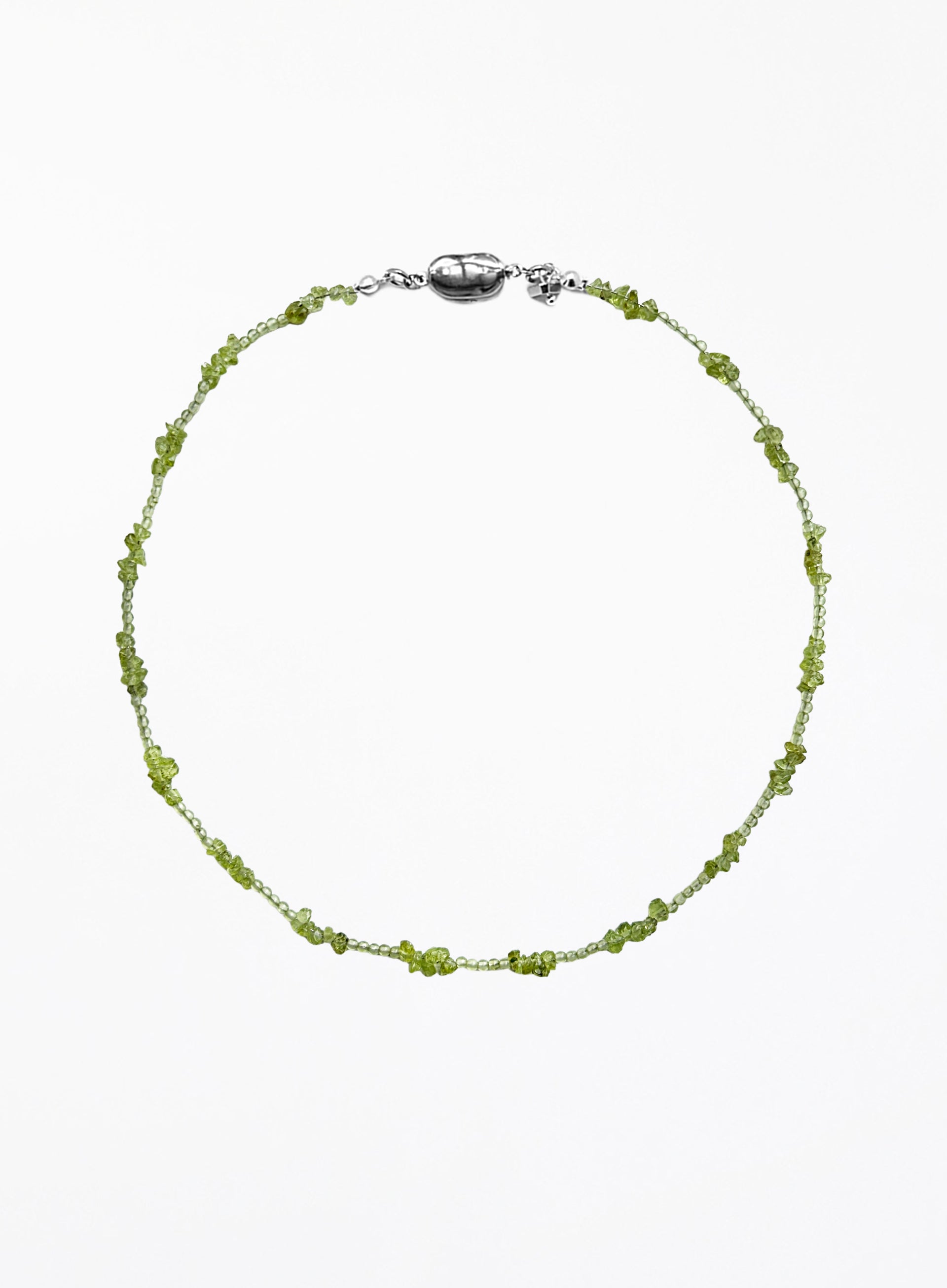 Green beaded necklace on a white background