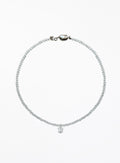 clear quartz beaded necklace with a floral charm