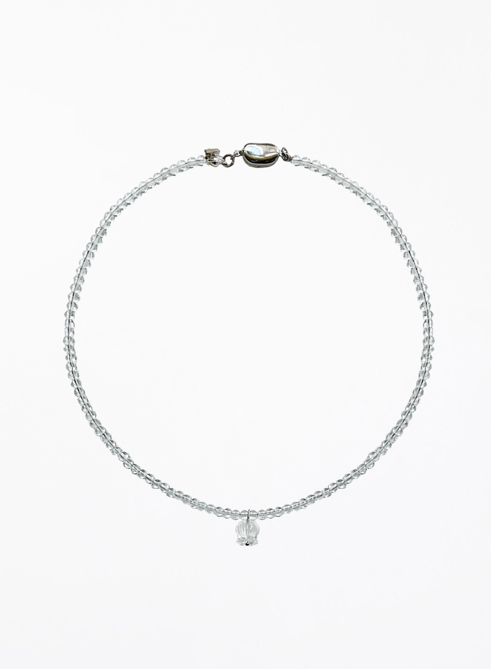 clear quartz beaded necklace with a floral charm