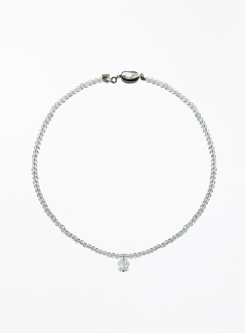 clear quartz beaded necklace with a floral charm