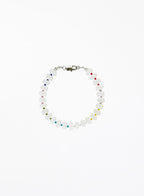 white jade beaded bracelet with multicolored accents on a white background