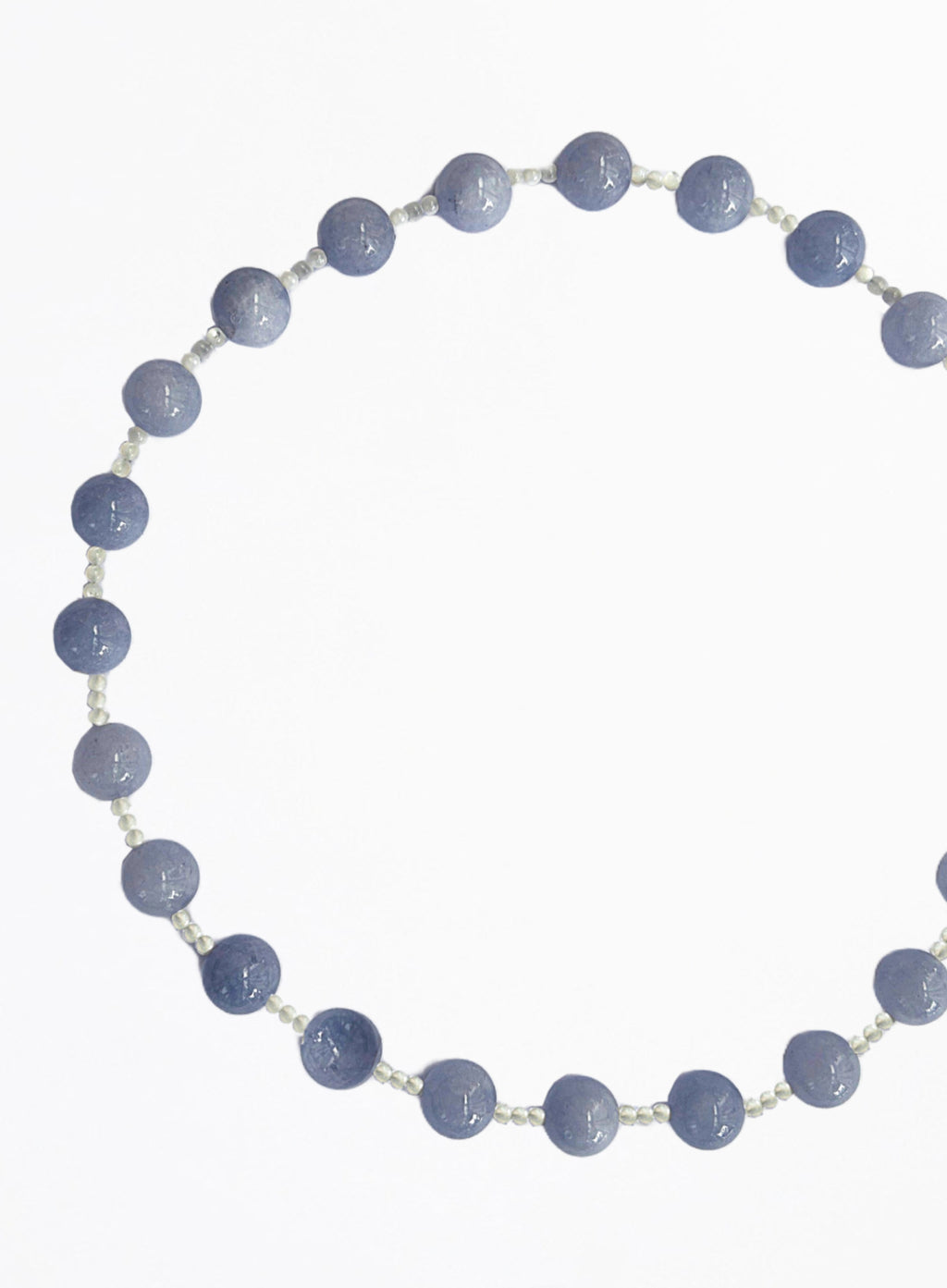 Necklace with blue beads on a white background