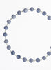 Necklace with blue beads on a white background
