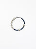 Pearl and navy bead bracelet on a white background