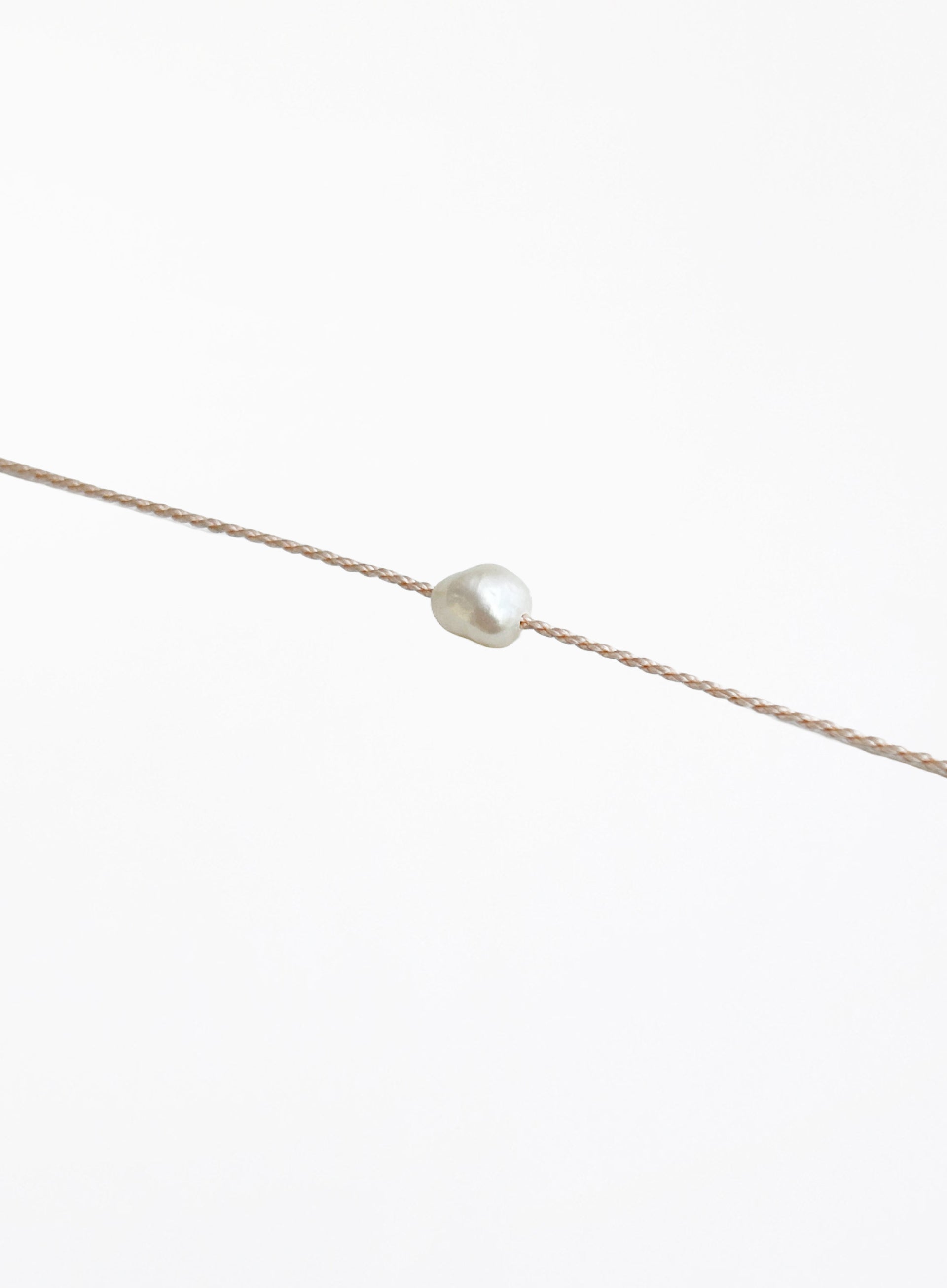 rose pink cord bracelet with pearl charm