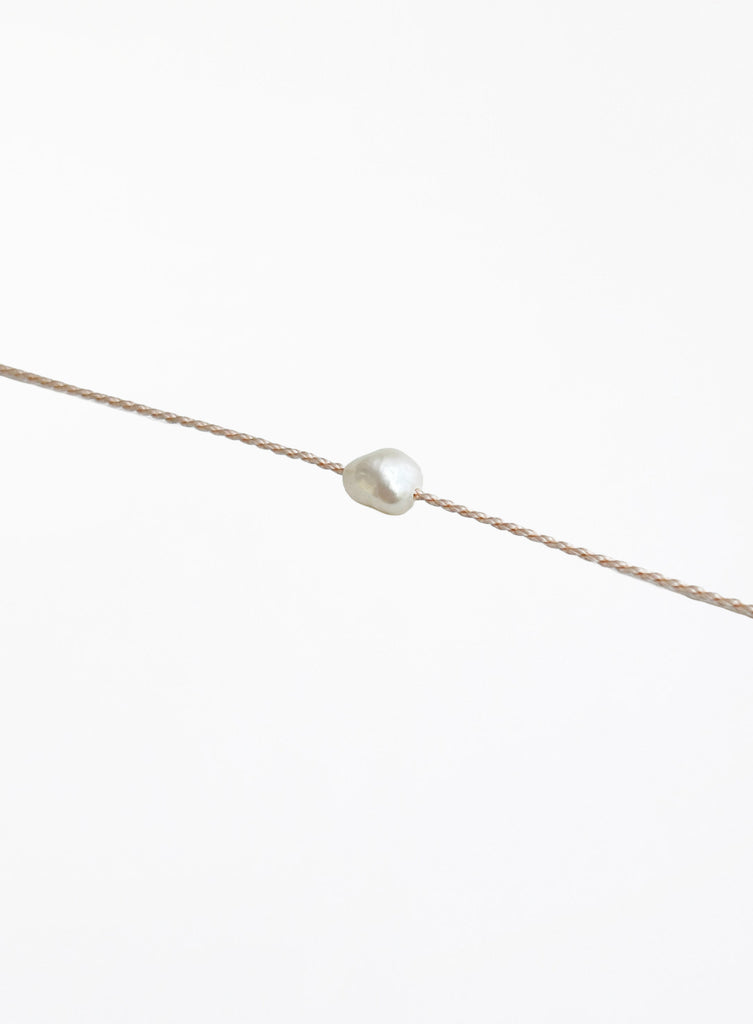 rose pink cord bracelet with pearl charm