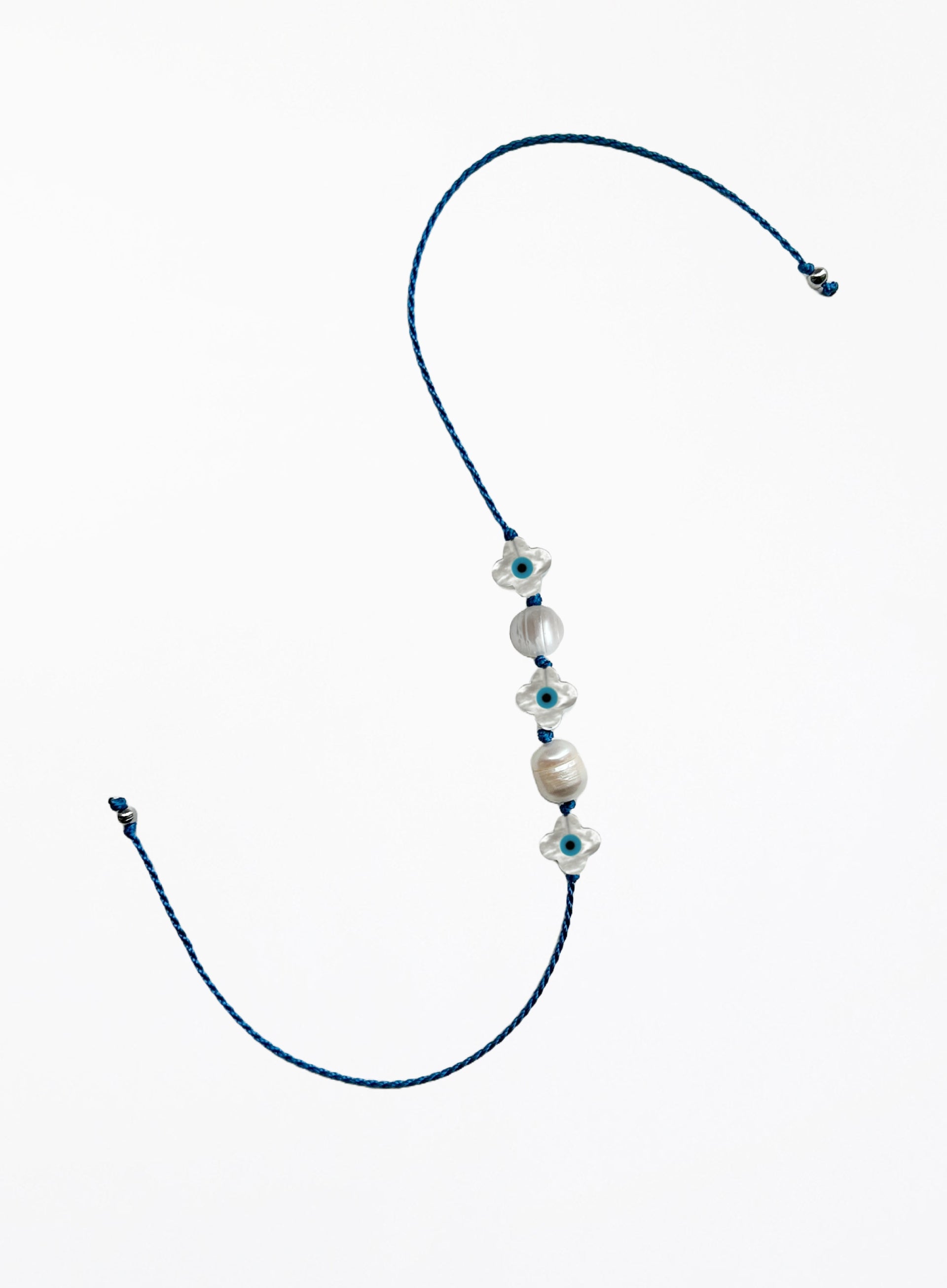 blue silk cord bracelet with eveil eye beads and pearls