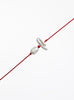 Red string with two pearls on a white background