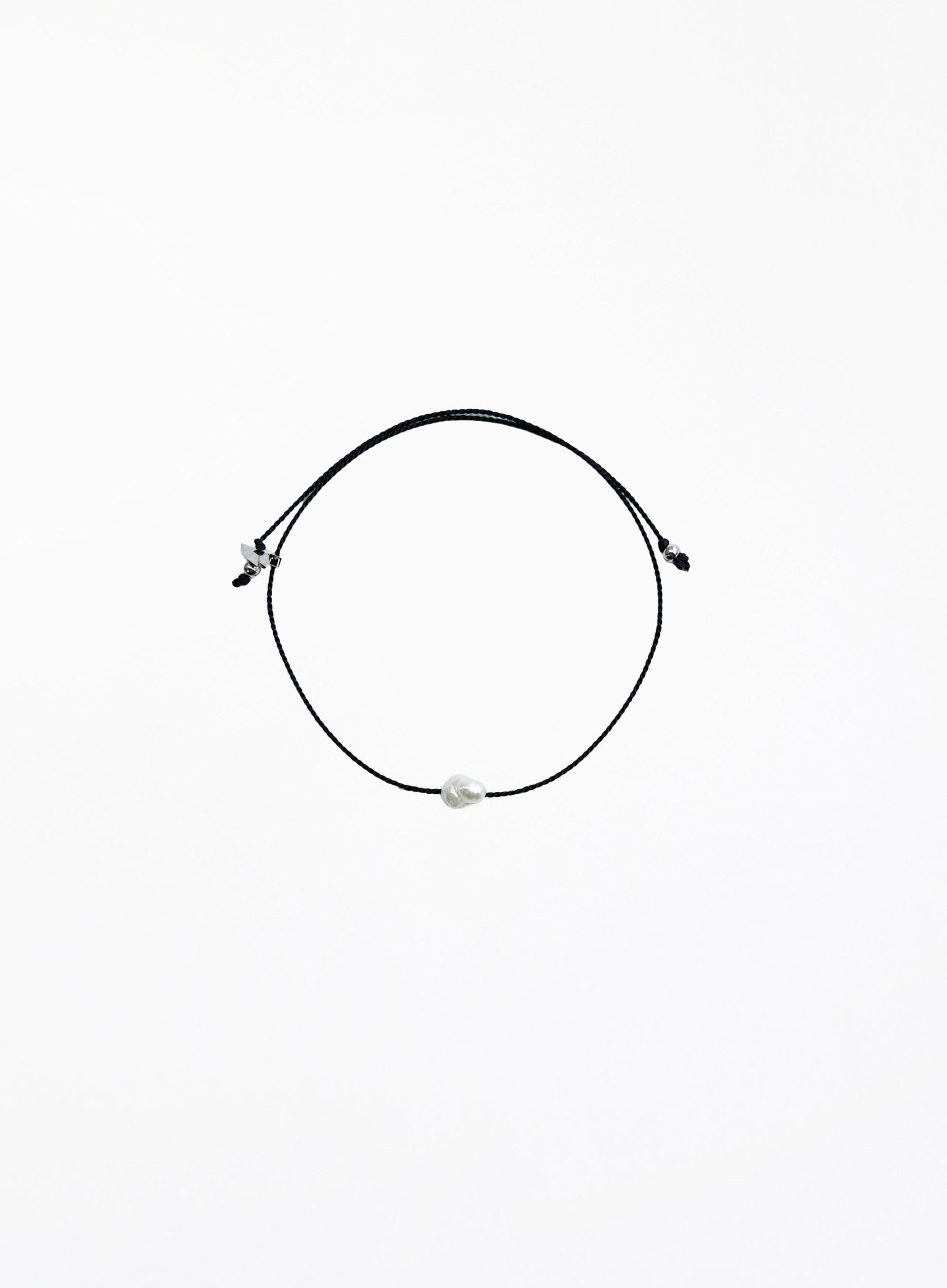 black bracelet with single pearl charm