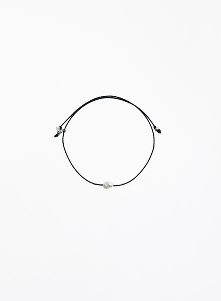 black bracelet with single pearl charm