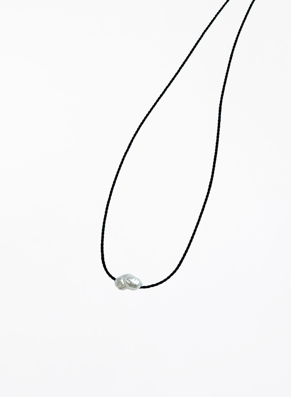 black bracelet with single pearl charm