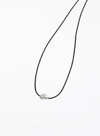 black bracelet with single pearl charm