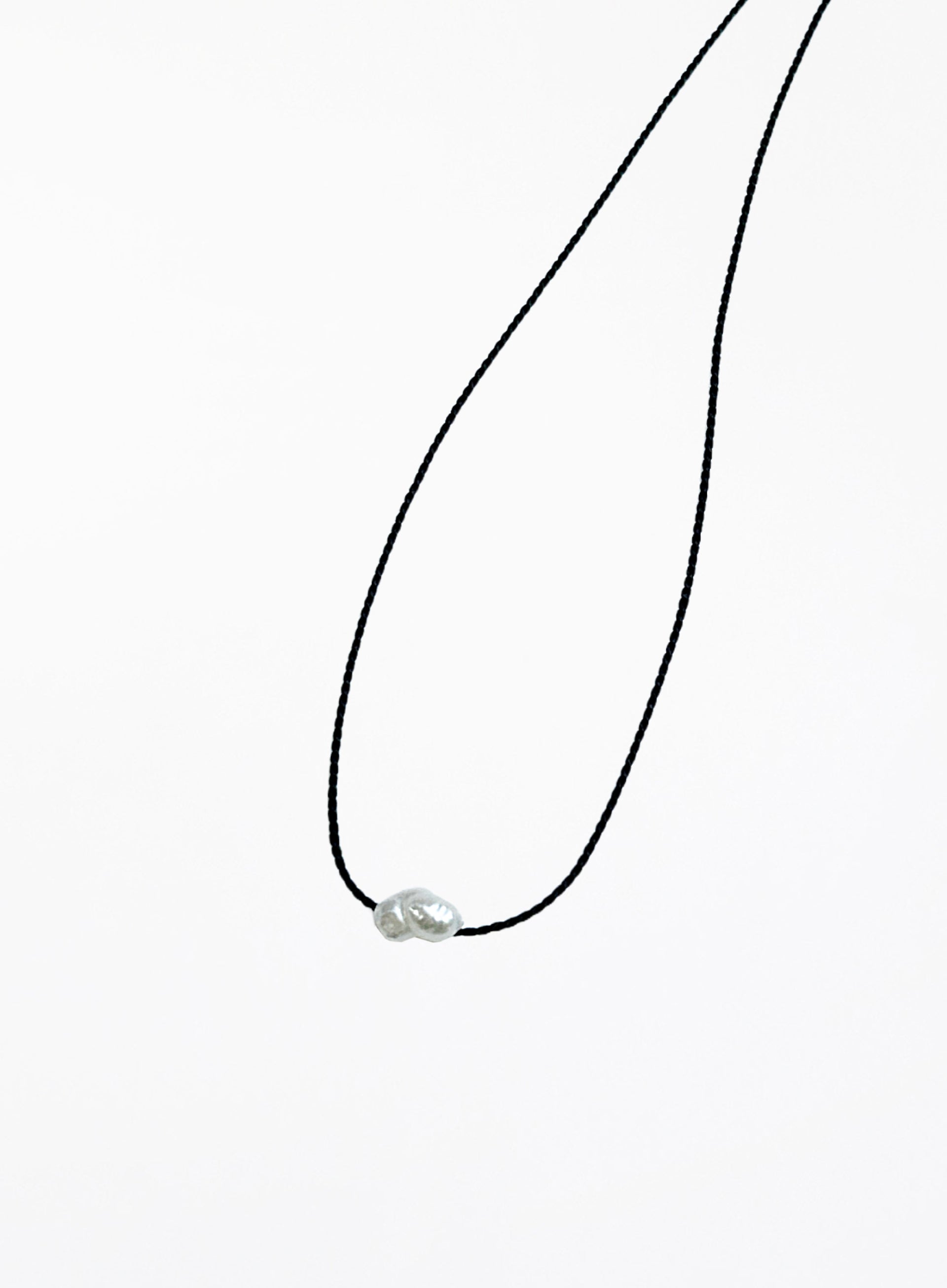 black bracelet with single pearl charm