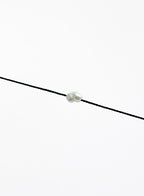 black bracelet with single pearl charm