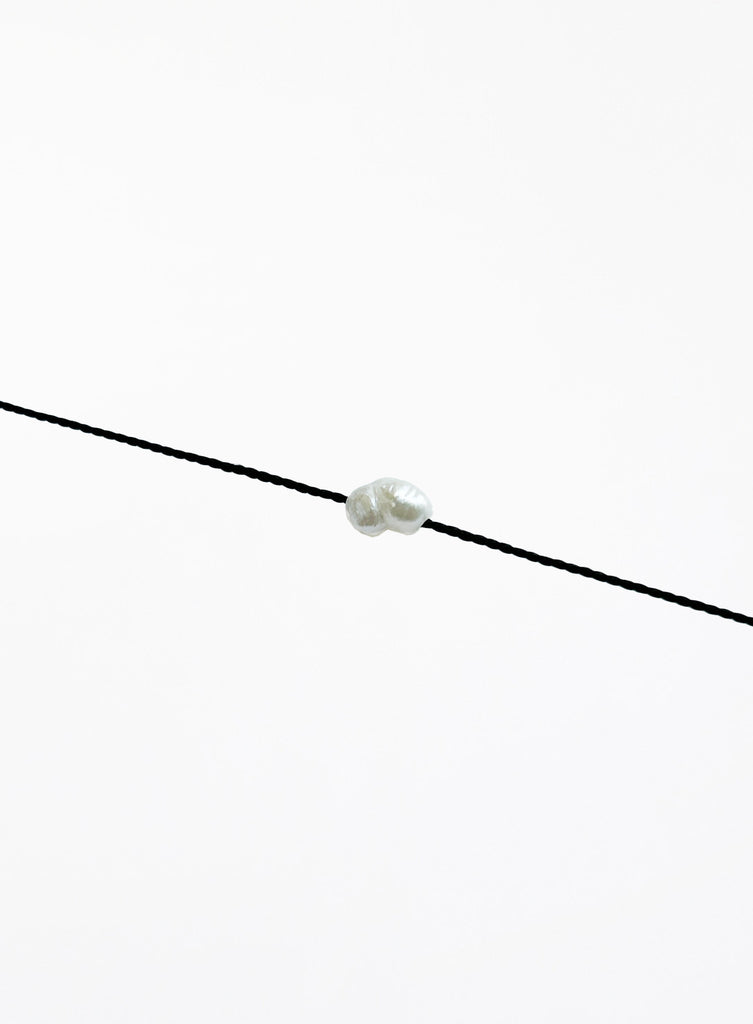 black bracelet with single pearl charm