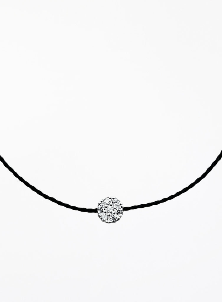 Black bracelet with a round crystal pendant on a white background