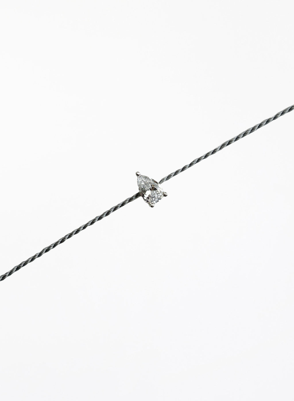 grey silk cord bracelet with teardrop cubic zirconia charm