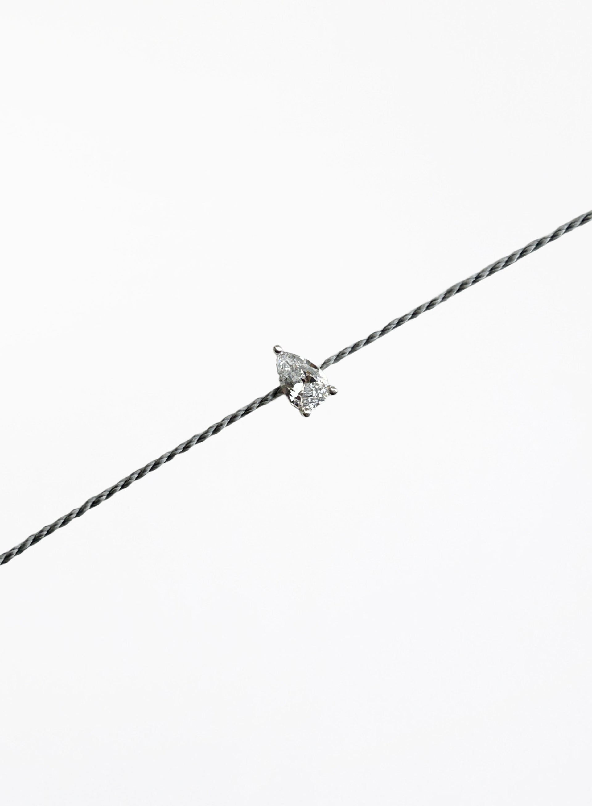 grey silk cord bracelet with teardrop cubic zirconia charm