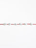 Red bracelet with pearls on a white background
