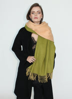 Woman wearing a green and beige scarf on a white background