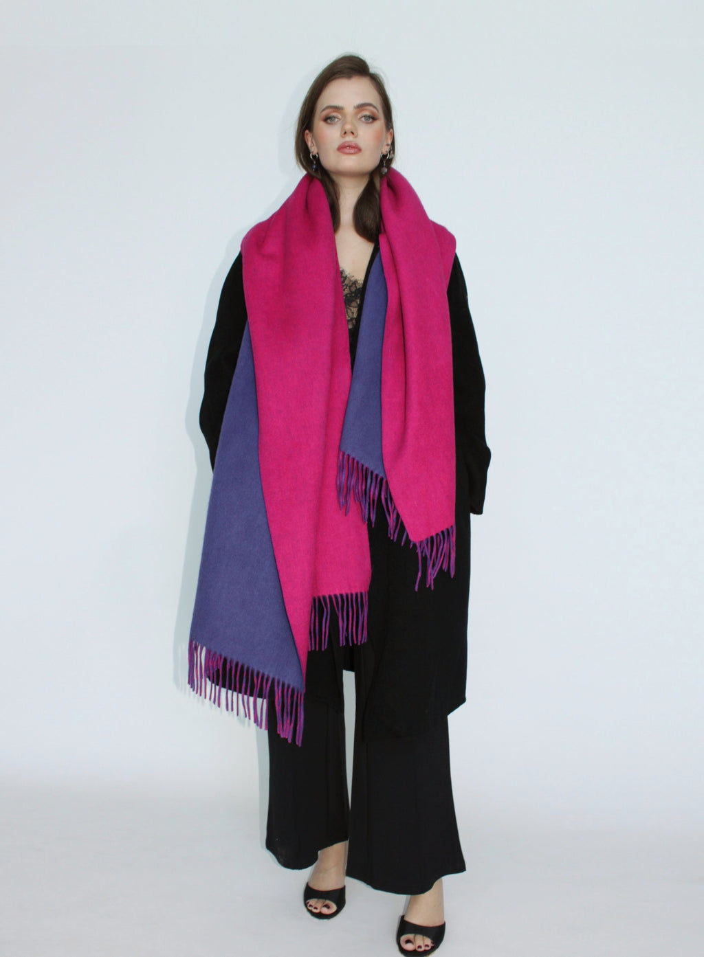 Woman wearing a pink and purple scarf on a white background