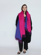 Woman wearing a pink and purple scarf on a white background