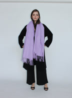 woman wearing a purple fringed scarf