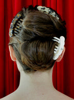 woman wearing multiple hairclaws